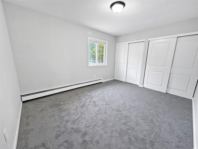 19 Leaf Ave, Central Islip, NY 11722 - unfurnished bedroom with multiple closets, baseboard heating, carpet floors, and baseboards