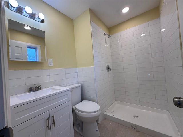 19 Leaf Ave, Central Islip, NY 11722 - full bath with a tile shower, toilet, vanity, tile walls, and tile patterned flooring