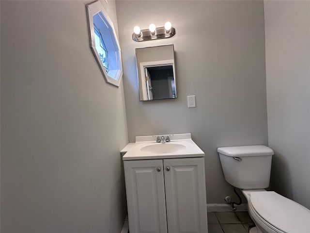 19 Leaf Ave, Central Islip, NY 11722 - bathroom featuring toilet, vanity, tile patterned floors, and baseboards