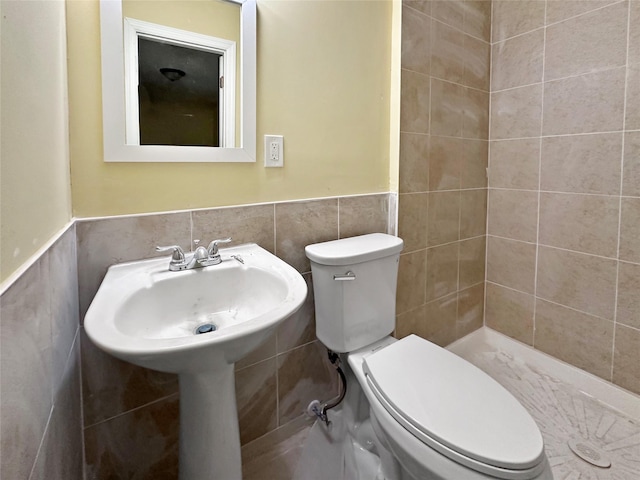 19 Leaf Ave, Central Islip, NY 11722 - bathroom with toilet, tile walls, a wainscoted wall, and tiled shower