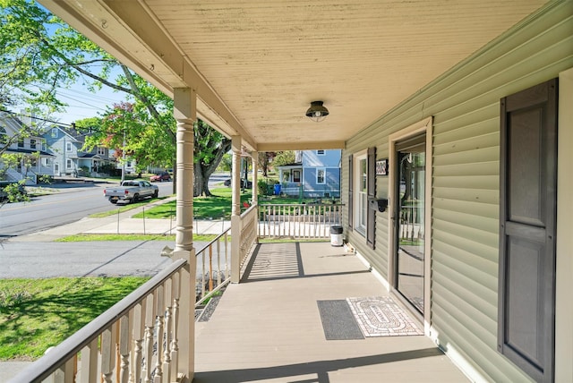 203 Highland Ave, Middletown, NY 10940 - covered porch featuring a residential view