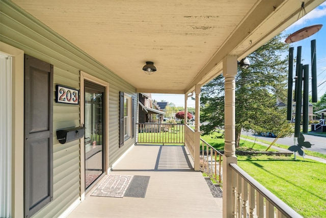 203 Highland Ave, Middletown, NY 10940 - porch featuring a lawn