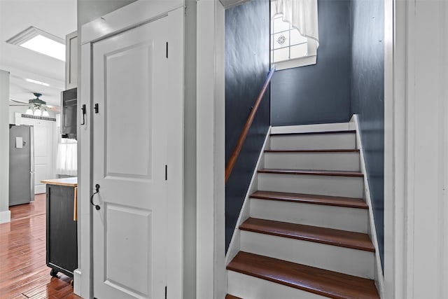 203 Highland Ave, Middletown, NY 10940 - stairway with wood finished floors and a ceiling fan