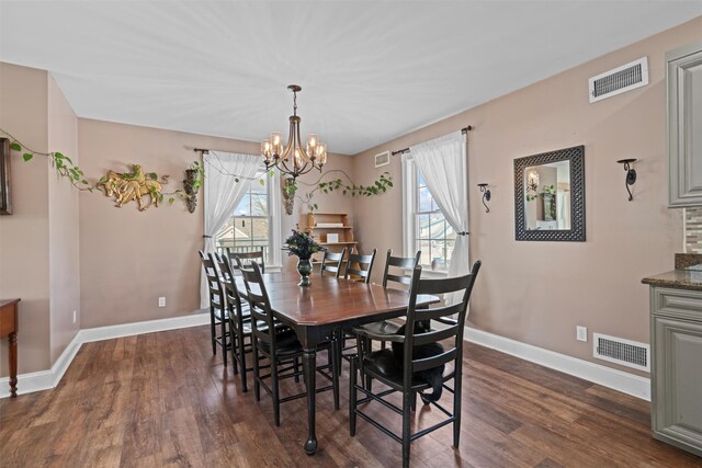 203 Highland Ave, Middletown, NY 10940 - dining area with dark wood finished floors, baseboards, and a chandelier