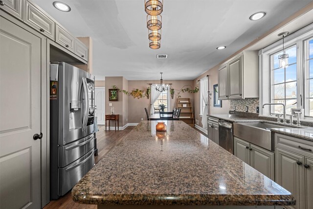 203 Highland Ave, Middletown, NY 10940 - kitchen with appliances with stainless steel finishes, a sink, dark wood-type flooring, a center island, and baseboards