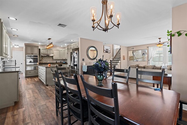 203 Highland Ave, Middletown, NY 10940 - dining space featuring dark wood-type flooring, stairs, ceiling fan, recessed lighting, and a chandelier