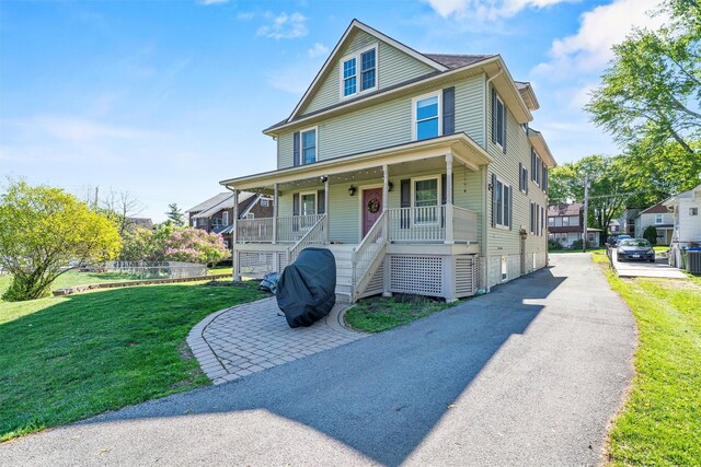 203 Highland Ave, Middletown, NY 10940 - view of front of home featuring a porch, a front lawn, and stairs