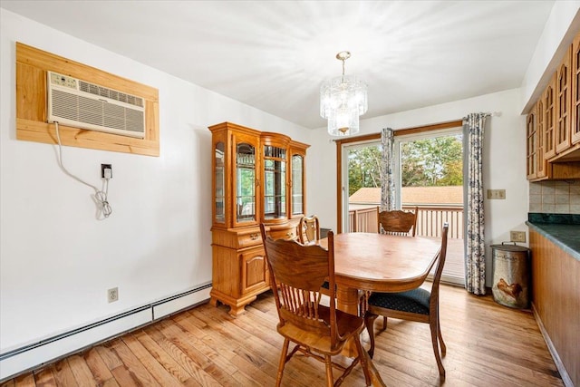 184 Mt Prosper Rd, Wurtsboro, NY 12790 - dining area featuring baseboard heating, a chandelier, light wood finished floors, and a wall mounted air conditioner