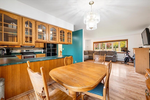 184 Mt Prosper Rd, Wurtsboro, NY 12790 - dining space featuring a chandelier, light wood-type flooring, and baseboard heating