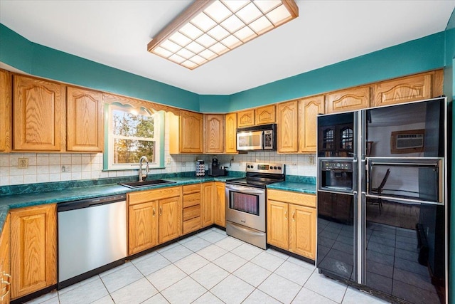 184 Mt Prosper Rd, Wurtsboro, NY 12790 - kitchen with appliances with stainless steel finishes, a sink, backsplash, dark countertops, and light tile patterned floors
