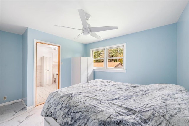 184 Mt Prosper Rd, Wurtsboro, NY 12790 - bedroom featuring light marble finish floors, baseboards, ceiling fan, and ensuite bath