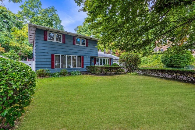 54A Upland Dr, East Northport, NY 11731 - view of front of home featuring a front lawn