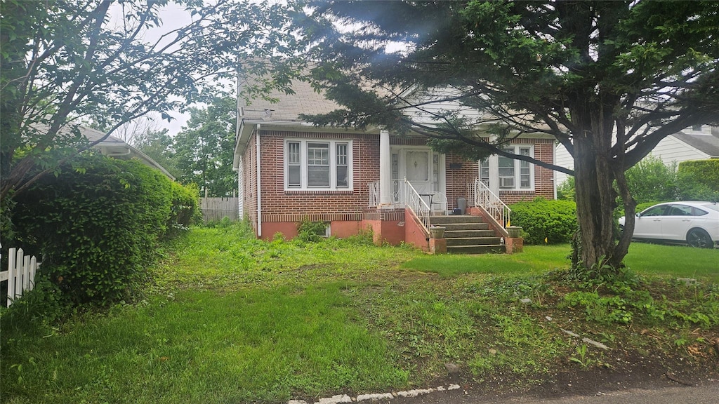 37 Netz Pl, Albertson, NY 11507 - view of front facade featuring brick siding