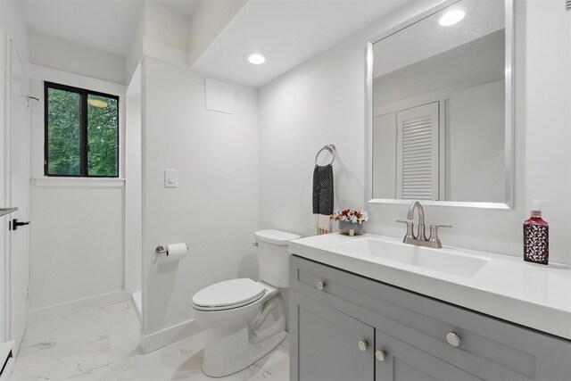 348 Heritage Hls Unit A, Somers, NY 10589 - bathroom featuring marble look tiles, vanity, toilet, recessed lighting, and baseboards