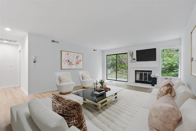 348 Heritage Hls Unit A, Somers, NY 10589 - living area with light wood finished floors, a fireplace, and baseboards