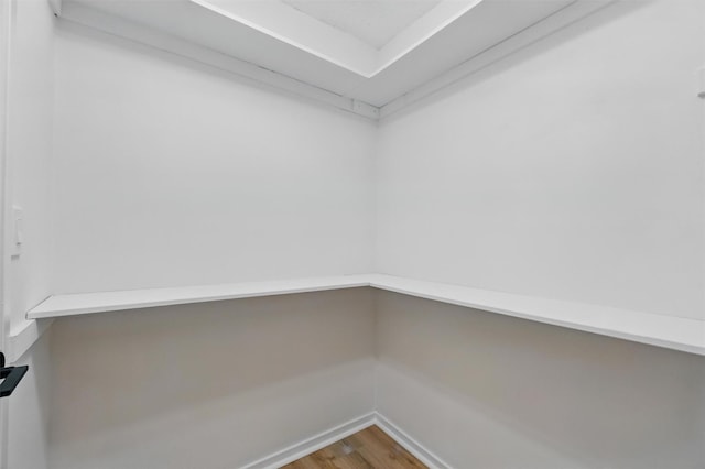 348 Heritage Hls Unit A, Somers, NY 10589 - walk in closet featuring wood finished floors