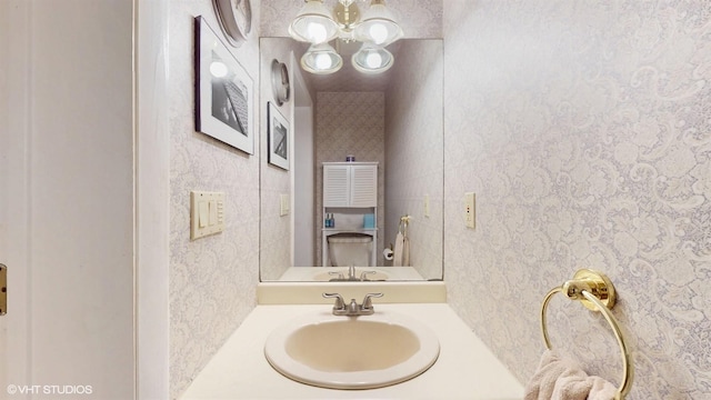 50 Snowden Ave, Ossining, NY 10562 - bathroom with vanity, a chandelier, and toilet