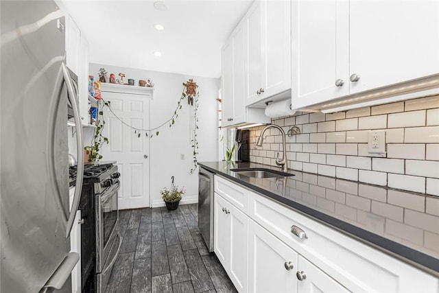4265 Webster Ave Unit 3H, Bronx, NY 10470 - kitchen with appliances with stainless steel finishes, a sink, dark countertops, backsplash, and dark wood-type flooring