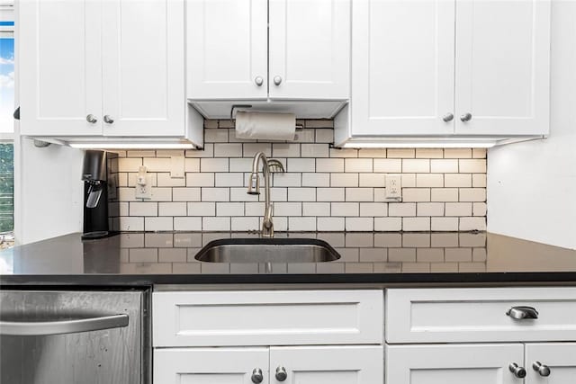 4265 Webster Ave Unit 3H, Bronx, NY 10470 - kitchen with a sink, dishwasher, dark countertops, and white cabinetry