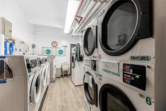 4265 Webster Ave Unit 3H, Bronx, NY 10470 - community laundry room with stacked washer and clothes dryer, washer and clothes dryer, and light wood finished floors