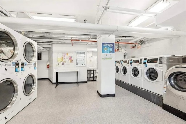 3 Fordham Hill Oval Unit 3D, Bronx, NY 10468 - community laundry room featuring stacked washer and clothes dryer, washing machine and clothes dryer, and baseboards