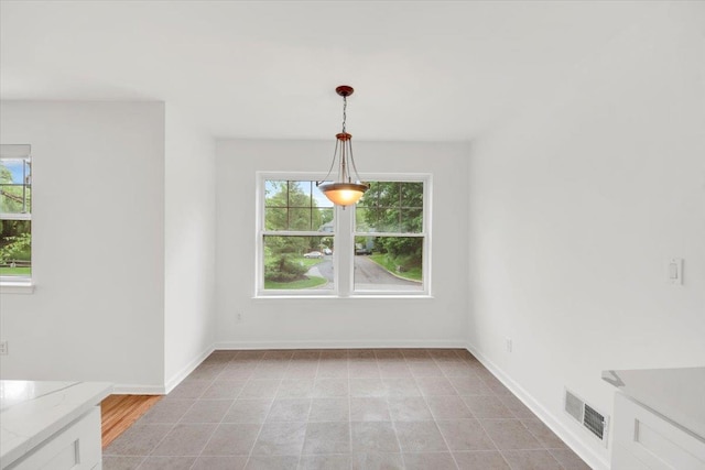 145 Underhill Ln Unit 145, Peekskill, NY 10566 - unfurnished dining area featuring plenty of natural light and baseboards