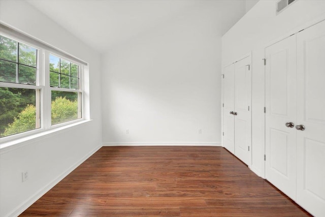 145 Underhill Ln Unit 145, Peekskill, NY 10566 - unfurnished bedroom with wood finished floors, baseboards, and two closets