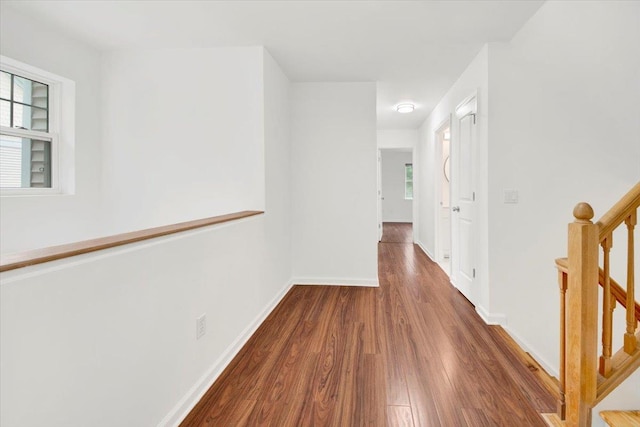 145 Underhill Ln Unit 145, Peekskill, NY 10566 - corridor with wood finished floors, stairs, plenty of natural light, and baseboards
