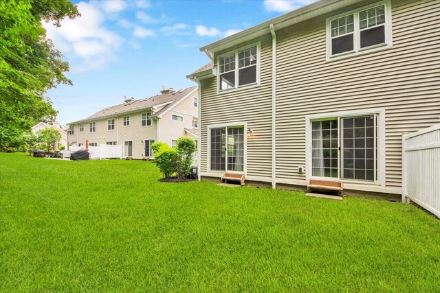 145 Underhill Ln Unit 145, Peekskill, NY 10566 - rear view of house featuring a lawn