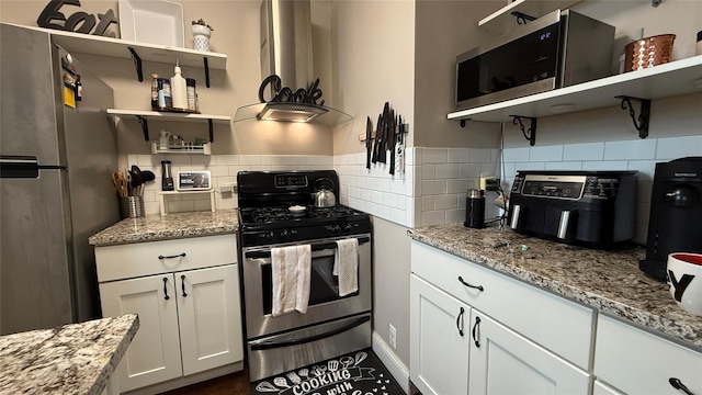 208 Centre Ave Unit 2J, New Rochelle, NY 10805 - kitchen with open shelves, stainless steel appliances, light stone counters, and white cabinets