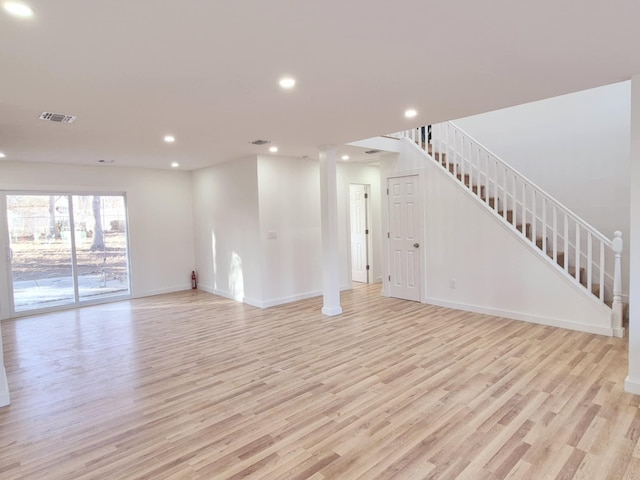 52 Nottingham Dr, Middle Island, NY 11953 - unfurnished living room featuring light wood-style floors, recessed lighting, baseboards, and stairs