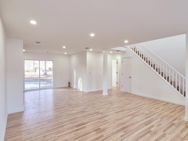 52 Nottingham Dr, Middle Island, NY 11953 - unfurnished living room with light wood-style floors, recessed lighting, baseboards, and stairs