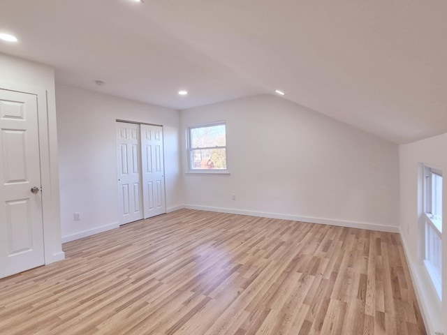 52 Nottingham Dr, Middle Island, NY 11953 - additional living space featuring light wood-style floors, vaulted ceiling, recessed lighting, and baseboards