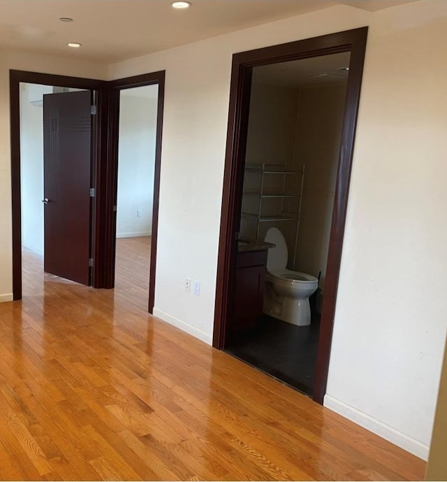 86 Canal St, New York Manhattan, NY 10002 - bathroom featuring toilet, baseboards, wood finished floors, and recessed lighting