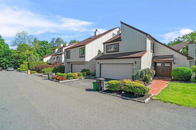6 Chippewa Ct, Suffern, NY 10901 - townhome / multi-family property with an attached garage and driveway