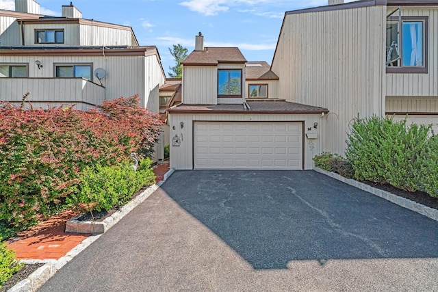 6 Chippewa Ct, Suffern, NY 10901 - multi unit property with asphalt driveway, a chimney, and a garage
