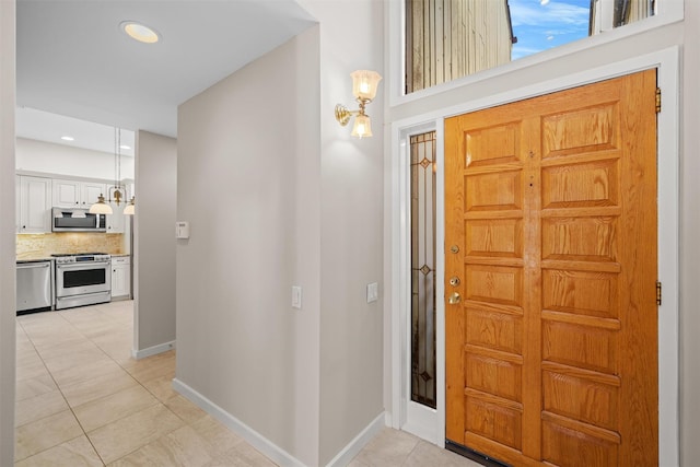 6 Chippewa Ct, Suffern, NY 10901 - foyer featuring light tile patterned floors, baseboards, recessed lighting, and a chandelier