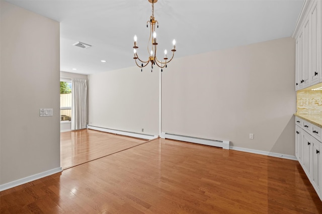 6 Chippewa Ct, Suffern, NY 10901 - unfurnished dining area with a baseboard heating unit, wood finished floors, a chandelier, baseboards, and recessed lighting
