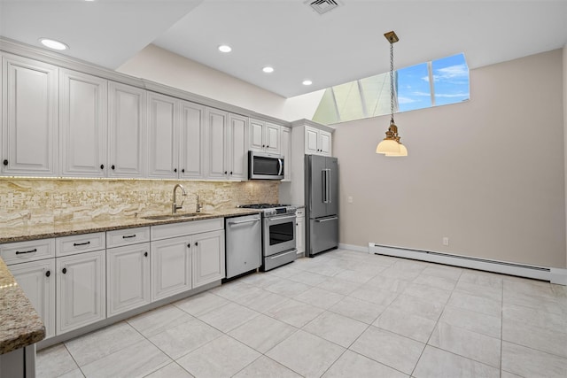 6 Chippewa Ct, Suffern, NY 10901 - kitchen with stainless steel appliances, baseboard heating, a sink, backsplash, and light stone counters