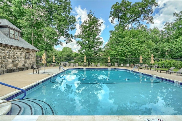 6 Chippewa Ct, Suffern, NY 10901 - community pool with a patio and view of scattered trees