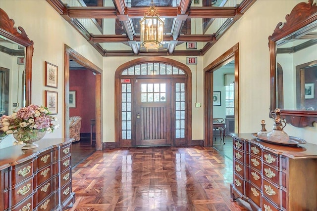 6 Chippewa Ct, Suffern, NY 10901 - foyer entrance featuring a chandelier, baseboards, ornamental molding, and beam ceiling