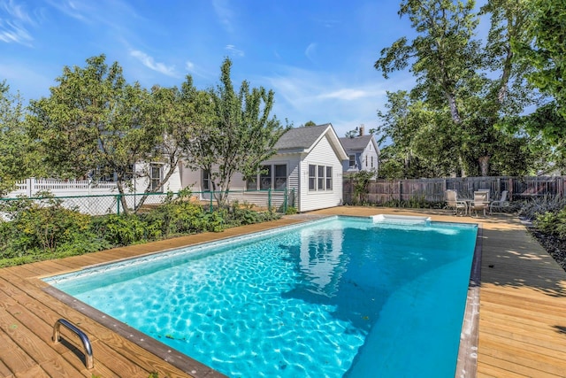 312 5th Ave, Greenport, NY 11944 - view of swimming pool featuring a deck and a fenced backyard