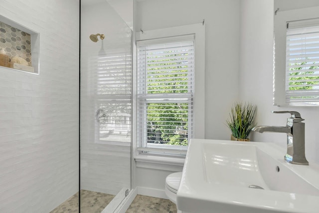 312 5th Ave, Greenport, NY 11944 - full bathroom featuring a sink, a walk in shower, and toilet