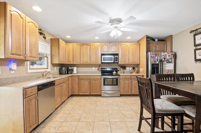 12 Midwood Pl, Farmingville, NY 11738 - kitchen with stainless steel appliances, a sink, light countertops, recessed lighting, and light tile patterned floors