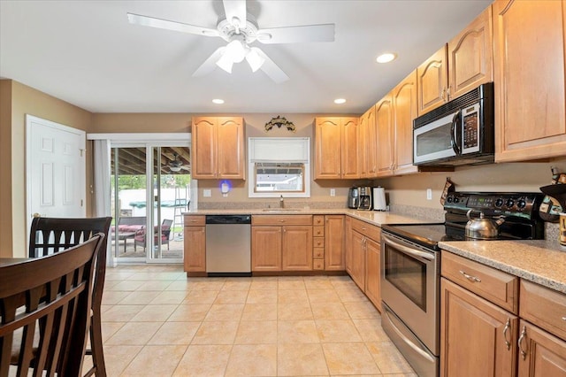 12 Midwood Pl, Farmingville, NY 11738 - kitchen with stainless steel appliances, a sink, recessed lighting, a ceiling fan, and light tile patterned floors