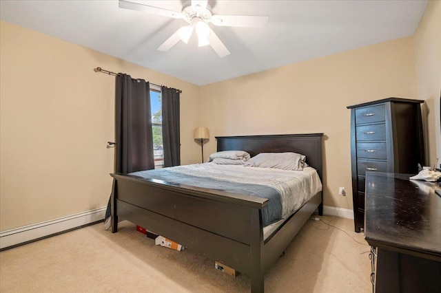 12 Midwood Pl, Farmingville, NY 11738 - bedroom with light carpet, baseboard heating, baseboards, and ceiling fan