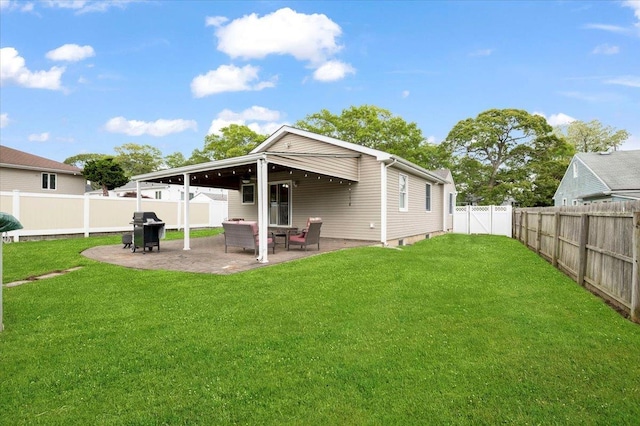 12 Midwood Pl, Farmingville, NY 11738 - back of house featuring a patio area and a gate