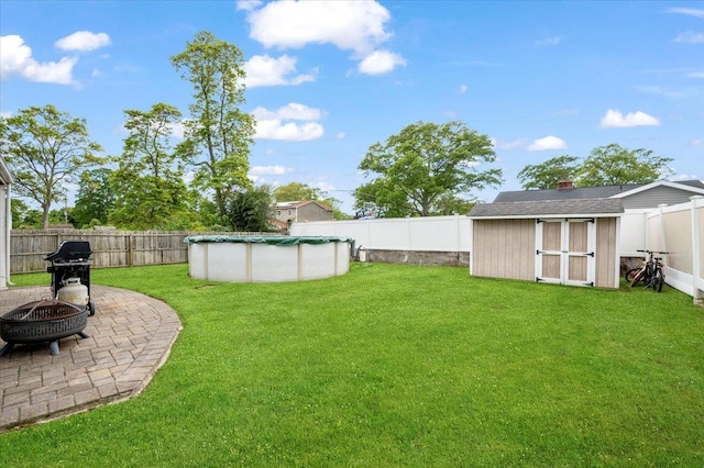 12 Midwood Pl, Farmingville, NY 11738 - view of yard featuring a fire pit and a patio