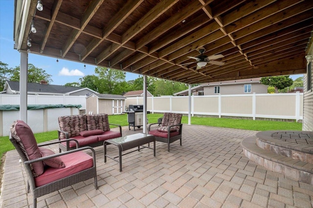 12 Midwood Pl, Farmingville, NY 11738 - fenced backyard featuring a patio, a grill, an outdoor living space, and a ceiling fan