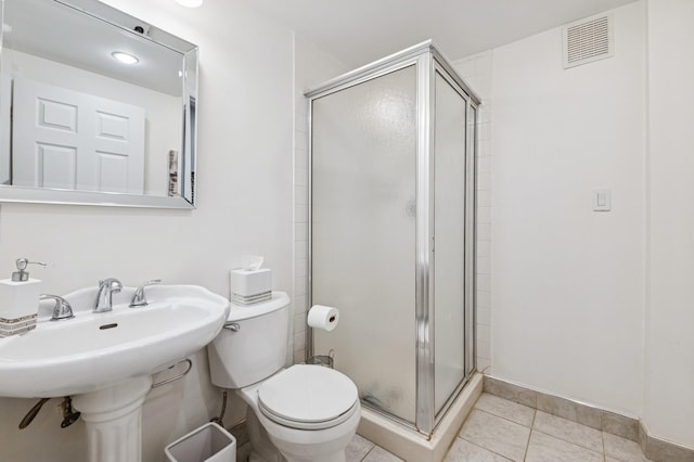 18 Woodcrest Rd, Kings Point, NY 11024 - bathroom featuring a stall shower, toilet, and tile patterned floors